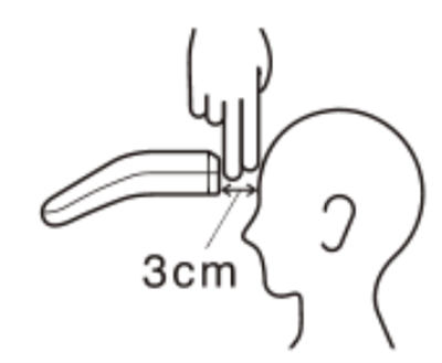 測定する額部分の前髪を上げ、プローブレンズを額の中心から3 cm間隔（指2本分）をあけ、額に対して平行に本体を持つ。